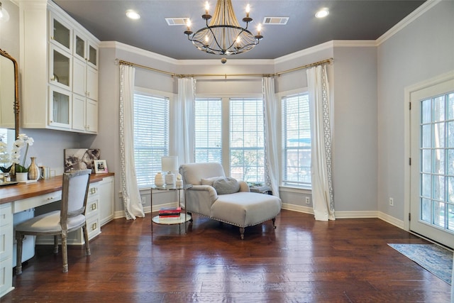 living area with dark wood-style flooring, built in study area, visible vents, and crown molding