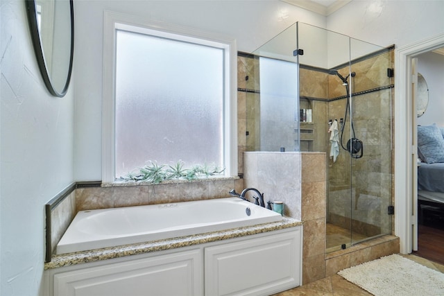 ensuite bathroom featuring a garden tub, connected bathroom, and tiled shower