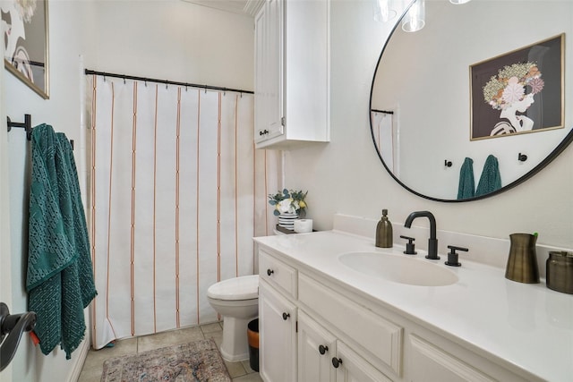 full bathroom featuring toilet, vanity, and tile patterned floors