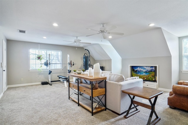 living area featuring recessed lighting, light colored carpet, visible vents, vaulted ceiling, and baseboards