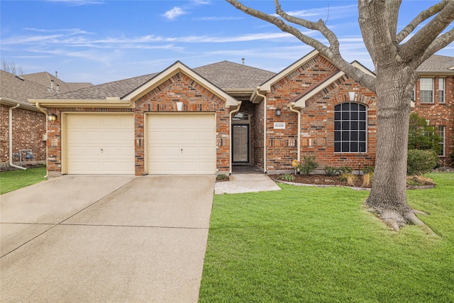 view of front facade with driveway, roof with shingles, an attached garage, a front lawn, and brick siding