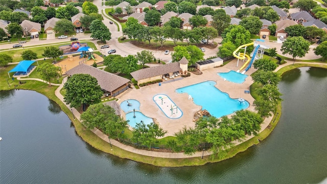 drone / aerial view featuring a water view and a residential view