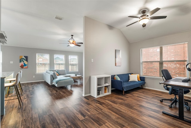 office with baseboards, visible vents, vaulted ceiling, and wood finished floors