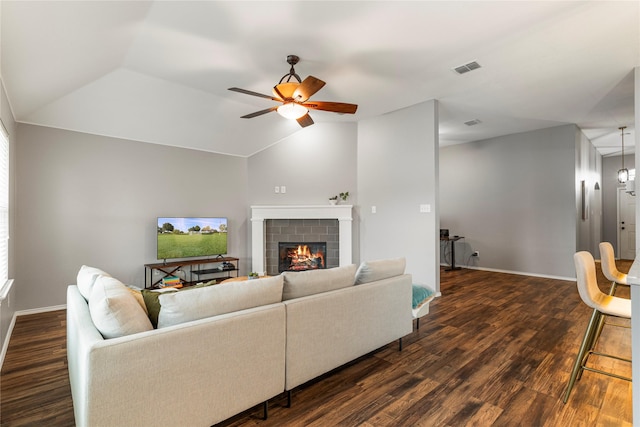 10206 Links Fairway, Rowlett, TX 75089 - living room featuring ceiling fan, dark wood-type flooring, a brick fireplace, baseboards, and vaulted ceiling