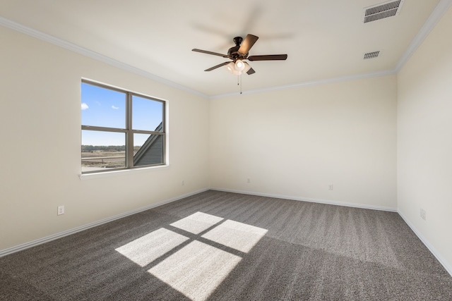 spare room featuring ornamental molding, carpet flooring, visible vents, and baseboards