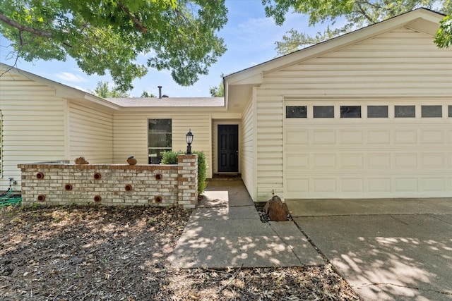 view of front of house featuring an attached garage and concrete driveway