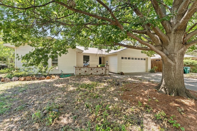 view of front of property with driveway and an attached garage