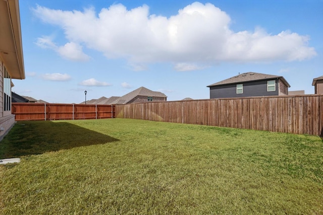 view of yard featuring a fenced backyard