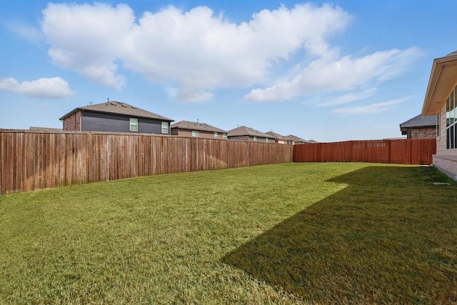 view of yard featuring a fenced backyard