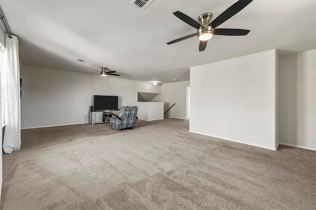 living room with carpet and visible vents