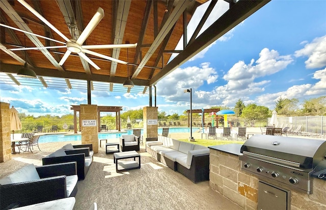 view of patio / terrace with a community pool, area for grilling, fence, a grill, and an outdoor living space