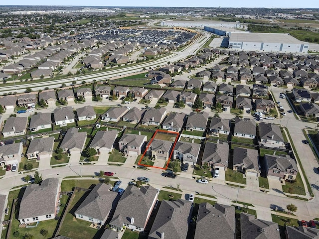 birds eye view of property with a residential view