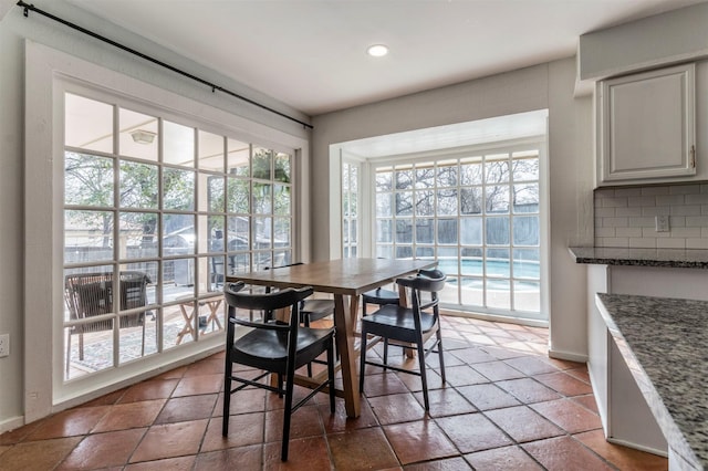 dining area with recessed lighting and baseboards