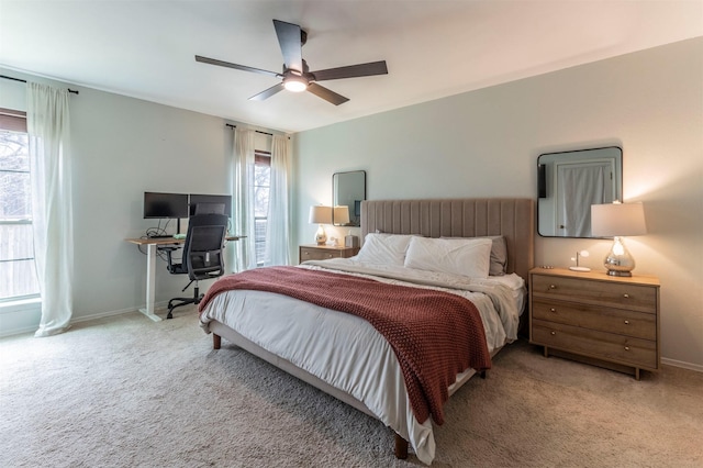 bedroom with baseboards, carpet, and a ceiling fan