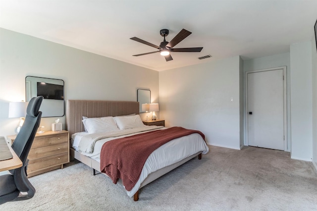 bedroom with visible vents, baseboards, ceiling fan, and carpet floors