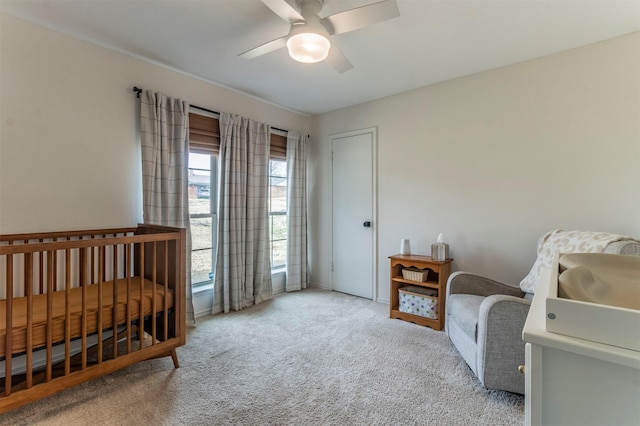 carpeted bedroom with a ceiling fan