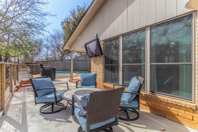 view of patio / terrace with a fenced in pool and a fenced backyard