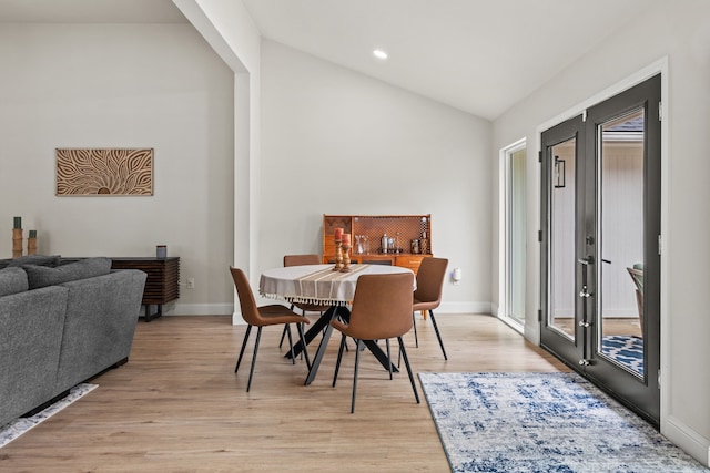 1607 Amesbury Ln, Rockwall, TX 75087 - dining space with french doors, light wood-style floors, baseboards, recessed lighting, and high vaulted ceiling