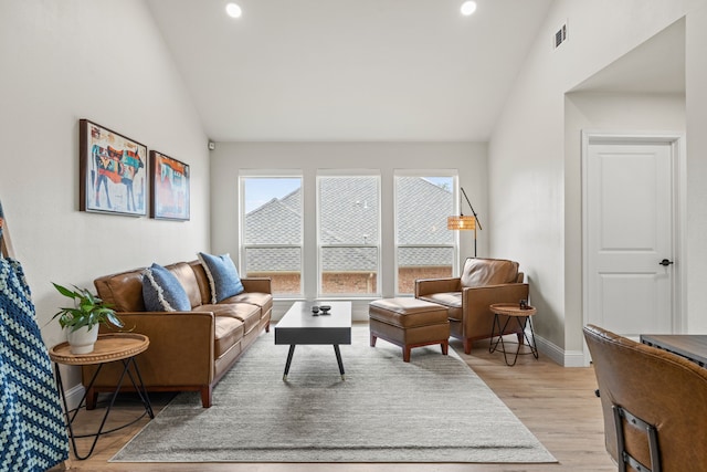 1607 Amesbury Ln, Rockwall, TX 75087 - living room featuring lofted ceiling, baseboards, recessed lighting, and light wood-style flooring