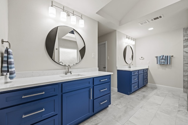 1607 Amesbury Ln, Rockwall, TX 75087 - full bathroom featuring marble look tiles, two vanities, and vaulted ceiling