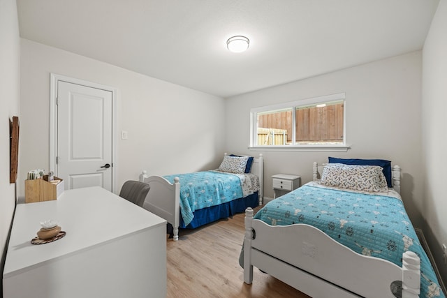 1607 Amesbury Ln, Rockwall, TX 75087 - bedroom featuring light wood-style floors and baseboards