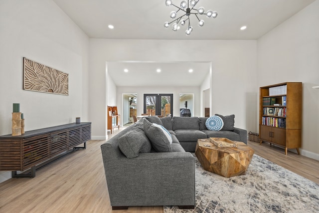 1607 Amesbury Ln, Rockwall, TX 75087 - living area featuring light wood-style floors, recessed lighting, baseboards, french doors, and a chandelier