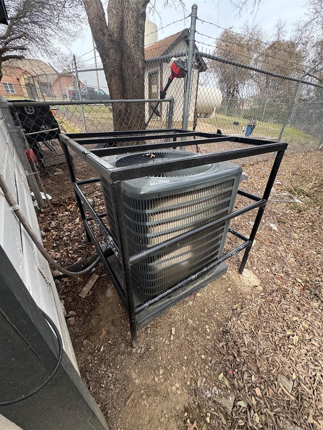 exterior details with central AC and fence