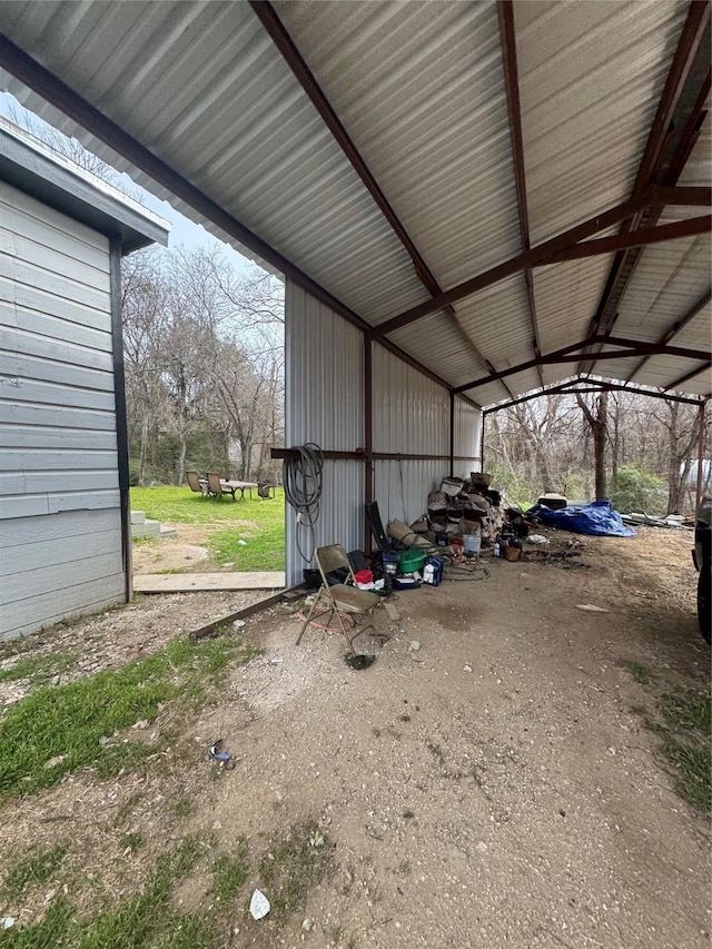 garage featuring a carport