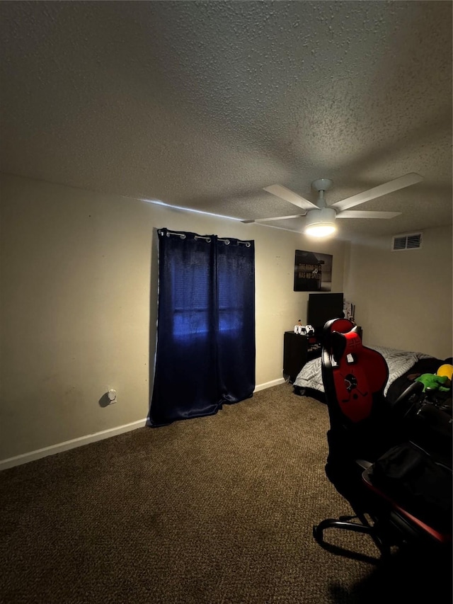 unfurnished bedroom featuring baseboards, a textured ceiling, visible vents, and carpet flooring