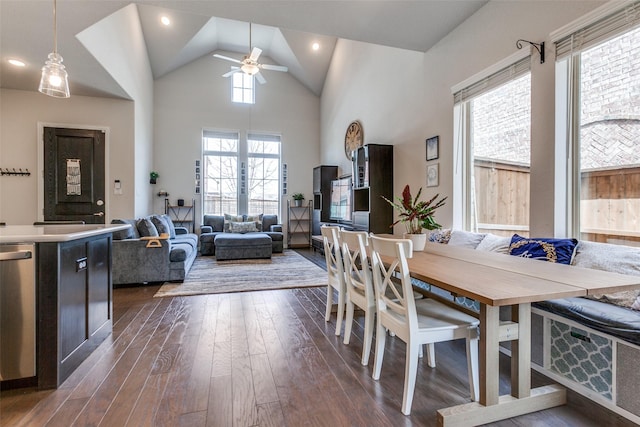 dining space featuring recessed lighting, high vaulted ceiling, ceiling fan, and dark wood-style flooring