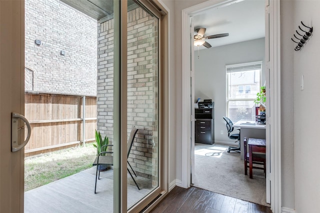 entryway with baseboards, dark wood-style floors, and a ceiling fan