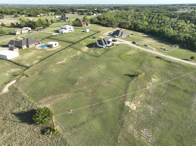 birds eye view of property with a rural view