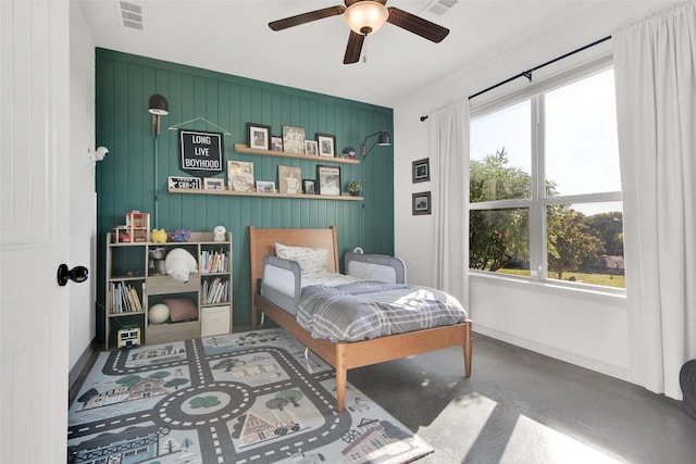 bedroom featuring ceiling fan, visible vents, and baseboards