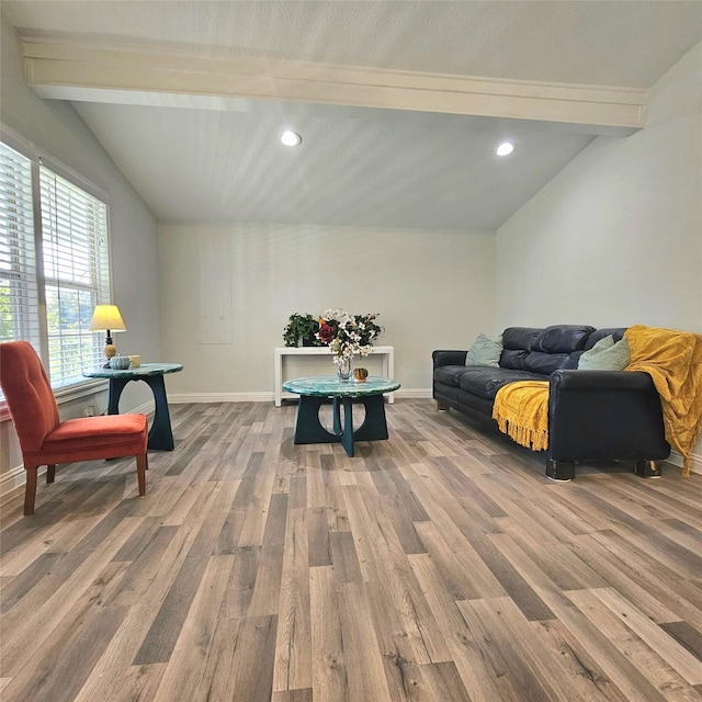 sitting room featuring lofted ceiling with beams, recessed lighting, wood finished floors, and baseboards