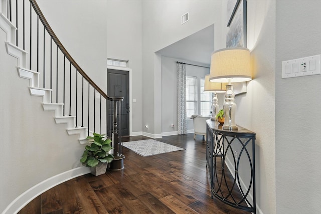 2813 Carrington Dr, Mansfield, TX 76063 - entryway with visible vents, baseboards, a towering ceiling, wood finished floors, and stairs