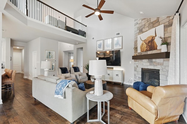2813 Carrington Dr, Mansfield, TX 76063 - living room featuring a fireplace, ceiling fan, high vaulted ceiling, visible vents, and dark wood finished floors