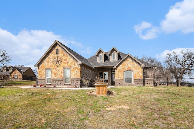 view of front facade featuring stone siding and a front lawn