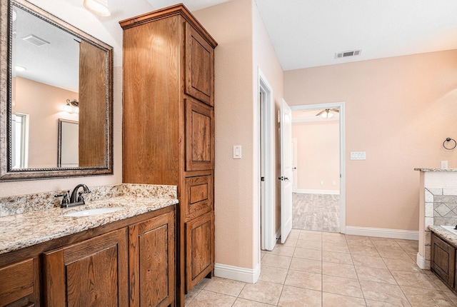 136 Clara Lee Ln, Springtown, TX 76082 - bathroom with baseboards, a garden tub, and vanity