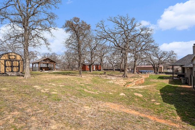 136 Clara Lee Ln, Springtown, TX 76082 - view of green lawn with a gazebo, an outbuilding, and a storage shed