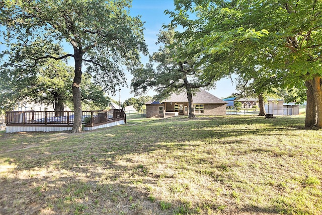 136 Clara Lee Ln, Springtown, TX 76082 - view of green lawn with a wooden deck