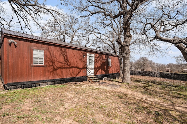136 Clara Lee Ln, Springtown, TX 76082 - view of home's exterior featuring entry steps and a metal roof