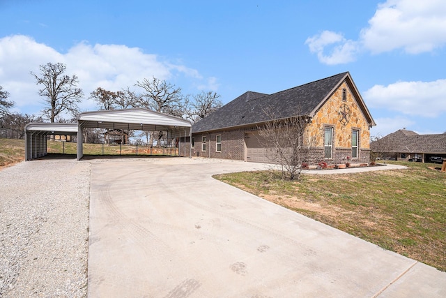136 Clara Lee Ln, Springtown, TX 76082 - view of front facade featuring concrete driveway, stone siding, a carport, and brick siding