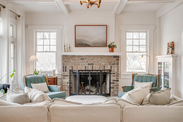 living room with beam ceiling, a fireplace, and a wealth of natural light