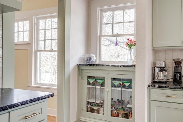 interior space featuring baseboards and decorative backsplash