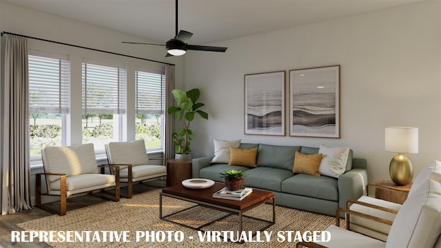 living room featuring wood finished floors and a ceiling fan