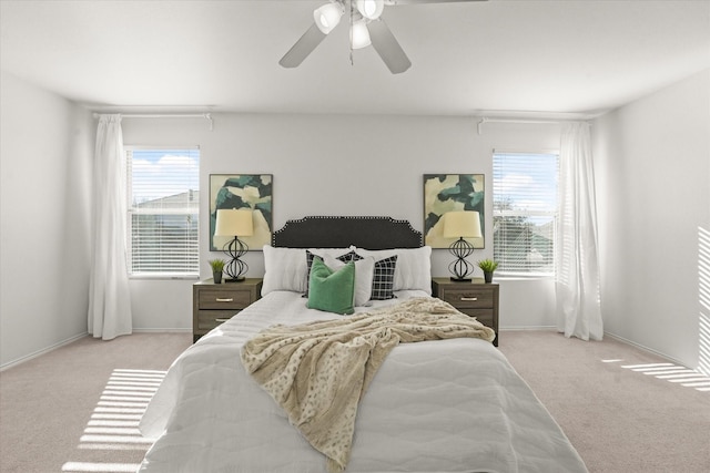 bedroom featuring baseboards, carpet, and a ceiling fan