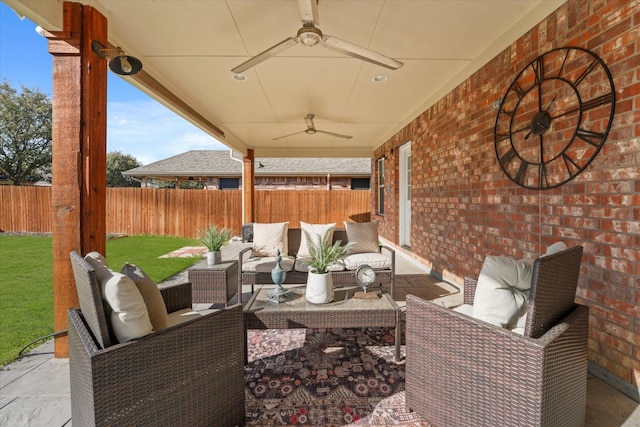 view of patio / terrace with an outdoor hangout area, fence, and ceiling fan