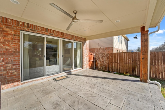 view of patio / terrace featuring fence and ceiling fan