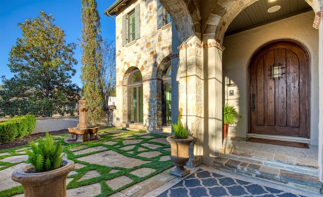 view of exterior entry with stone siding