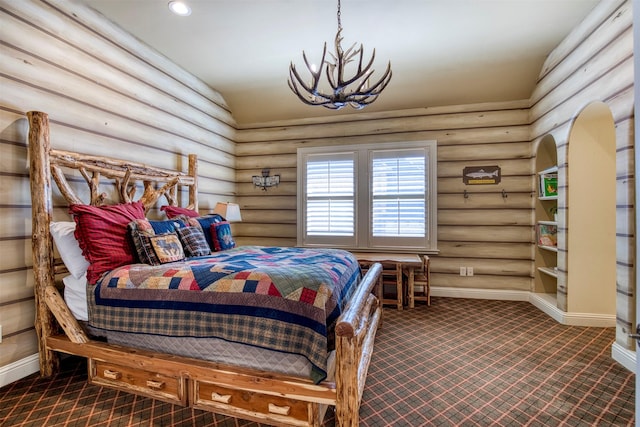 bedroom with a notable chandelier, log walls, dark colored carpet, recessed lighting, and baseboards